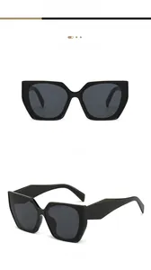 Détail de lunettes de soleil géométriques noires avec verres gris foncé de qualité