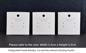 Detailed view of white jewelry display cards for earrings with dimensions 5.5cm x 5.5cm