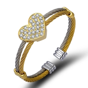Three-row cable heart bracelet in gold and silver finish with sparkling rhinestones