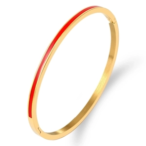 Minimalist gold titanium steel bracelet featuring a red enamel band with a brushed metal finish