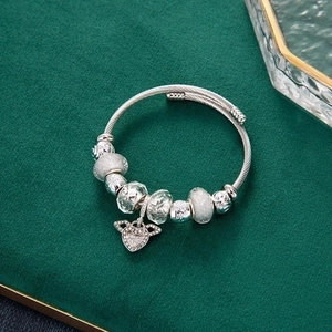 Silver beaded charm bracelet with angel wings heart pendant on adjustable steel wire