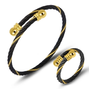 Detail shot of the black and gold steel cable wire jewelry set with bracelet and ring