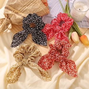 Floral fabric scrunchies with bow tie detail in multiple colors for women hair styling