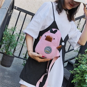 Pink canvas crossbody bag featuring a cute 3D cartoon penguin design on a model