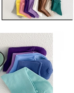 Detailed texture of colorful cotton knit socks featuring breathable rolled cuffs