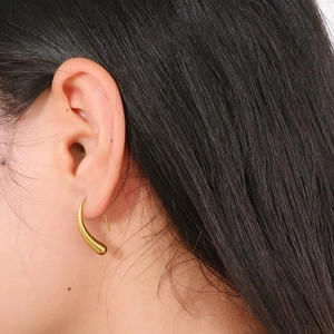 Fashionable golden irregular teardrop stud earring for women in sleek geometric design