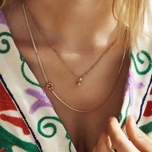 Double layered gold plated heart necklace set featuring a delicate chain and knot design