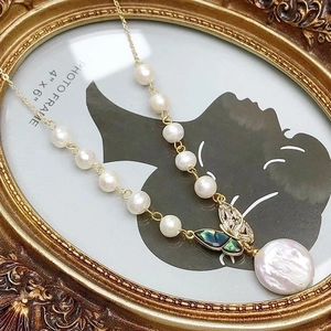 Baroque pearl necklace with gold butterfly pendant and shimmering mother of pearl inlay