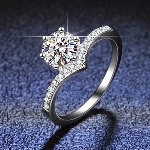 Macro shot of V-shaped S925 silver ring featuring a round brilliant moissanite stone