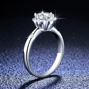 Macro shot of 1 carat moissanite ring showing 6-prong setting and polished silver band