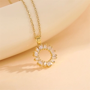 Elegant gold necklace with geometric zircon circle pendant on minimalist prop background