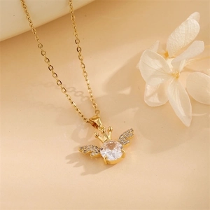 Golden crown wing pendant necklace featuring a central clear gem and sparkly crystal accents