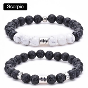Detailed macro view of Scorpio beaded bracelets with lava stone and white turquoise beads