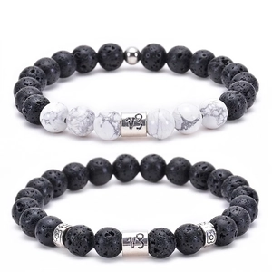 Detail of Capricorn bracelet set featuring white turquoise and black volcanic lava stone