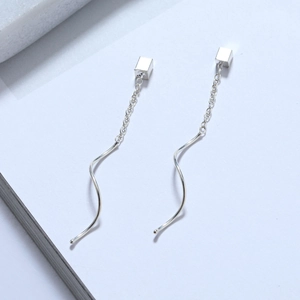 Detail of s925 silver long tassel earrings with geometric cubes and wave line design