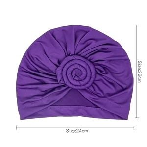 Purple donut turban for women with knotted flower design and 24x22cm dimensions