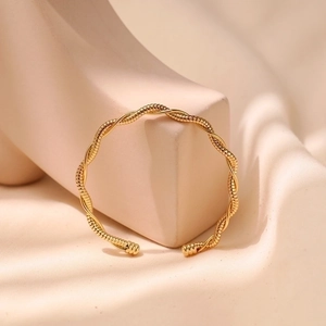 Minimalist gold twisted wave open bangle bracelet with geometric vintage metal design