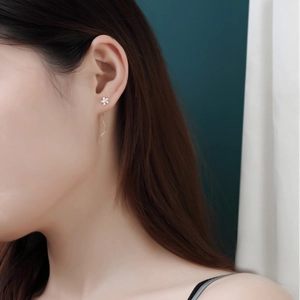 Minimalist S925 sterling silver wavy tassel earrings with delicate flower design