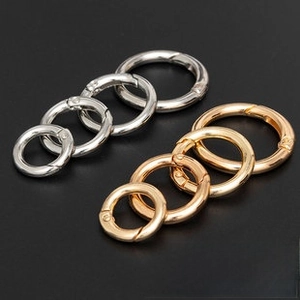 Polished metal spring rings in gold and silver finishes in four different sizes