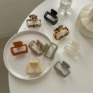 Chic acetate leopard print square hair claws in various elegant marble and amber patterns