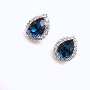 Elegant halo pear-cut blue sapphire stud earrings with cubic zirconia in silver