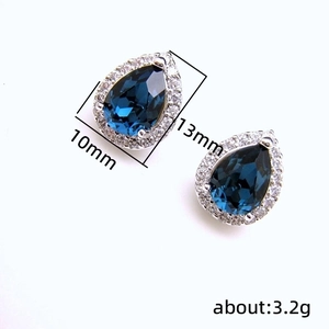 Elegant water drop blue sapphire stud earrings with cubic zirconia halo in silver finish