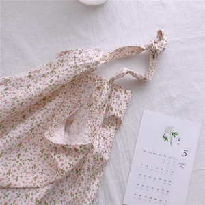 Floral cotton tote bag with a soft ribbon handle and delicate pink floral patterns