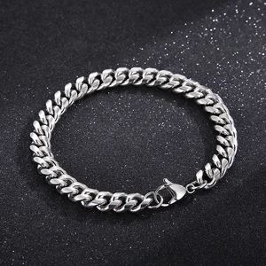 Close-up of polished silver stainless steel Cuban chain bracelet with lobster clasp