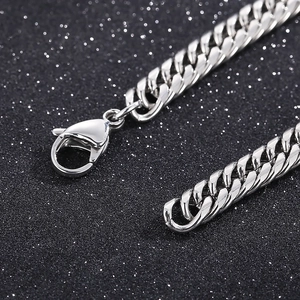 Detail of silver stainless steel curb chain links with a secure lobster clasp closure