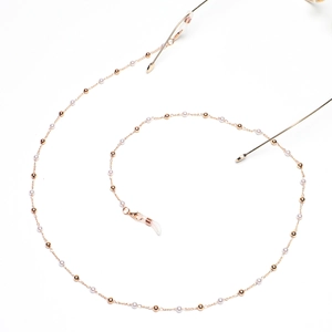 Fashionable gold metal glasses chain with elegant white pearls and non-slip rubber loops