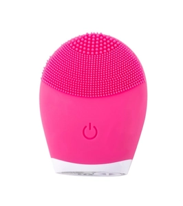 Detailed close-up of a pink silicone facial cleanser with soft massage bristles and power button
