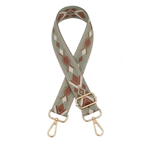 Detail of bohemian geometric jacquard bag strap with gold metal lobster clasps