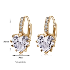 Detail view of heart-shaped zircon earrings with size markings 18mm by 10mm