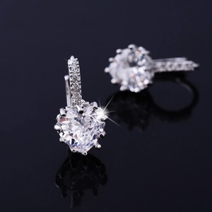 Macro shot of AAA heart zirconia earrings with sparkling silver plated hoop detail
