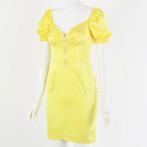 Detailed view of yellow satin mini dress featuring puff sleeves and front zipper closure