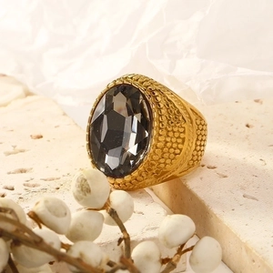 Punk vintage gold plated stainless steel ring with a large grey oval gemstone