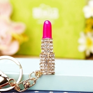 Cute lipstick car keychain with sparkling crystals and golden metal accessories