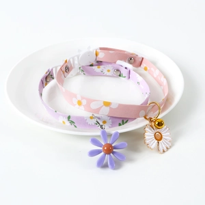 Adjustable daisy floral pet collars in pink and purple with flower pendants