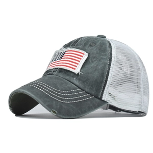 Detail of vintage washed cotton baseball cap with American flag embroidery and mesh back