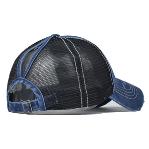 Detail showing the ponytail hole design and breathable mesh on the blue washed cotton cap