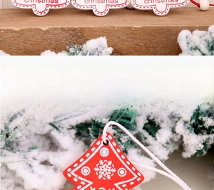 Detail display of wooden Christmas tree pendants with snowflake patterns and white beads