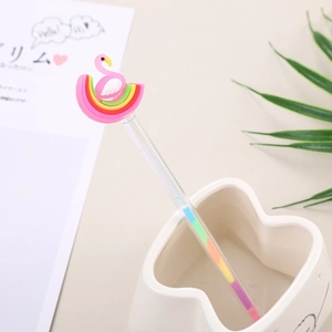 Rainbow flamingo gel pen with transparent barrel in a minimalist desk organizer