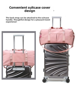 Pink gym bag with luggage strap sleeve showing functional detail on suitcase handle