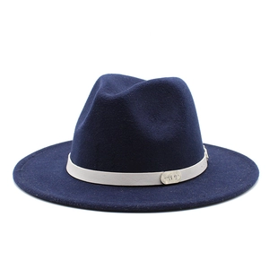 Detail of navy blue felt fedora featuring a light-colored band with an oval metal buckle