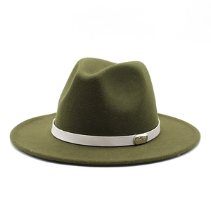 Close-up of olive wool fedora hat with cream ribbon and engraved gold buckle detail