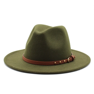 Close-up of olive green wool fedora hat featuring brown leather band with gold rivets