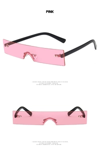 Detail view of pink rectangle rimless sunglasses with black temples and metal accents