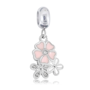 Detail of silver pendant with pink and white enamel flowers and sparkling rhinestones