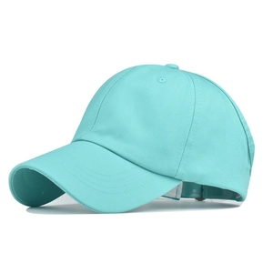 Detail view of mint green cotton ponytail baseball cap with adjustable strap and breathable eyelets