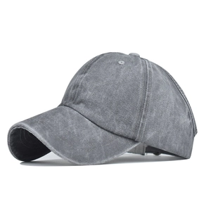 Detail view of dark grey washed cotton ponytail cap with six-panel structure and curved brim